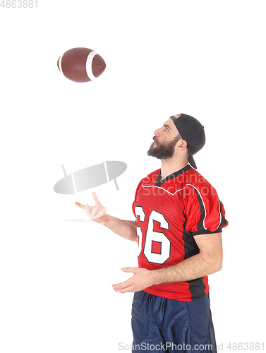 Image of Football player playing with his football