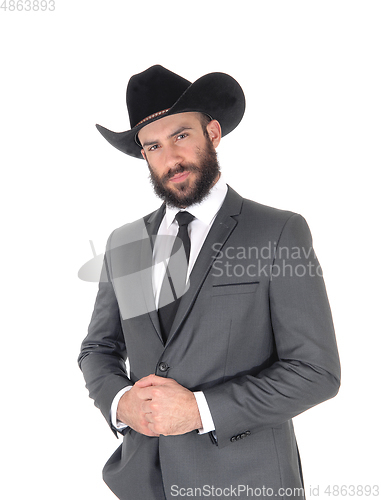 Image of Portrait of man in a suit and cowboy hat