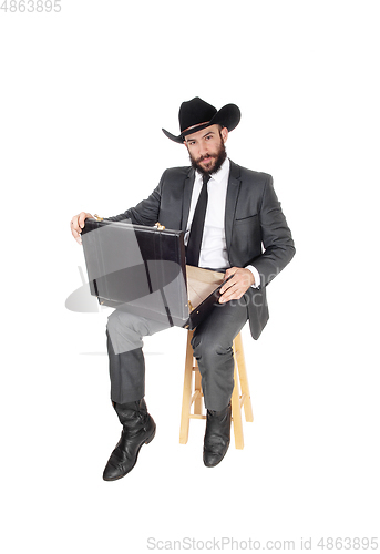 Image of Business man looking in his briefcase
