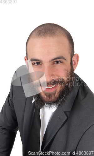 Image of Business man sitting, bending forward, smiling