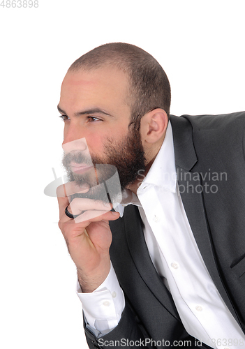 Image of Portrait of businessman with hand on his chin thinking