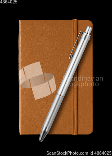 Image of Leather closed notebook and pen isolated on black