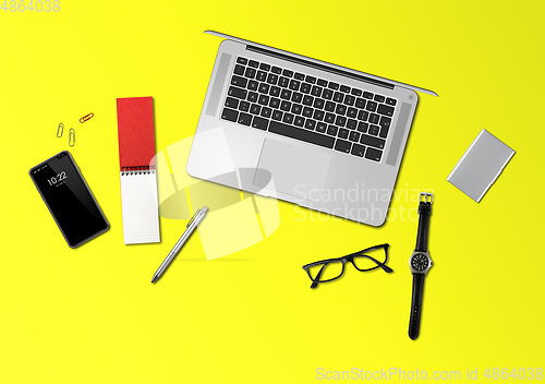 Image of Office desk mockup top view isolated on yellow