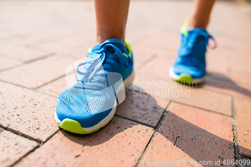 Image of Woman running at city