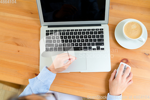 Image of Female hands with laptop computer