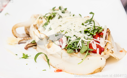 Image of Cuttlefish with tomato, salad and Parmigiano cheese