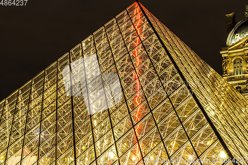 Image of The Louvre at night in Paris