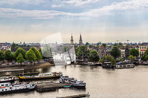 Image of Amsterdam canals and  boats, Holland, Netherlands.