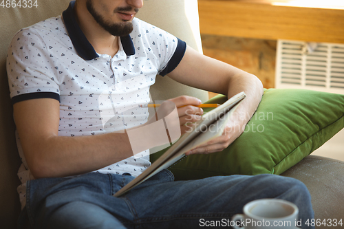 Image of Man working from home during coronavirus or COVID-19 quarantine, remote office concept