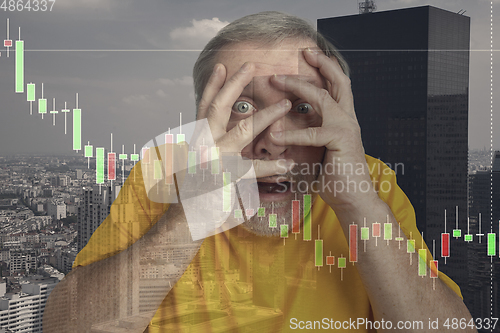 Image of Stressed senior man holding head with hands on abstract city background. Double exposure with graphs. Virus alert, coronavirus pandemic, crisis, unemployment