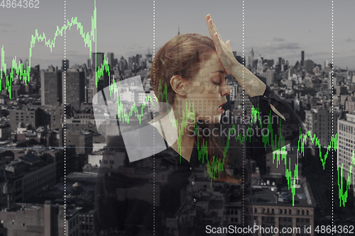 Image of Stressed woman holding head with hands on abstract city background. Double exposure with graphs. Virus alert, coronavirus pandemic, crisis, unemployment