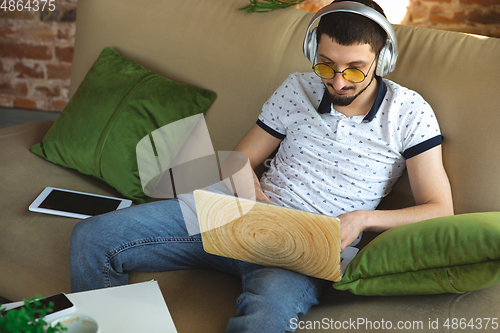 Image of Man working from home during coronavirus or COVID-19 quarantine, remote office concept