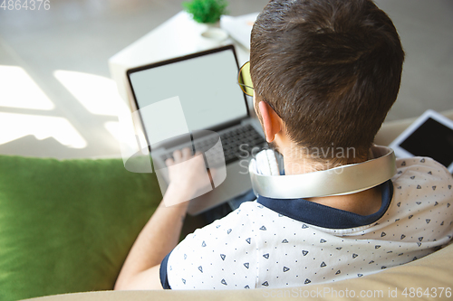 Image of Man working from home during coronavirus or COVID-19 quarantine, remote office concept