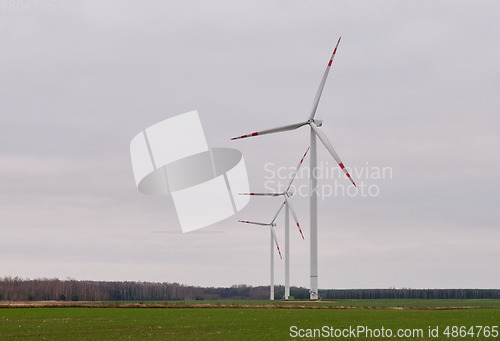 Image of Wind energy plant under cloudy sky