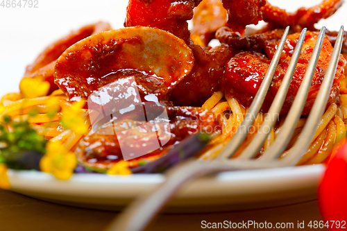 Image of Italian seafood spaghetti pasta on red tomato sauce