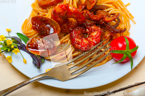 Image of Italian seafood spaghetti pasta on red tomato sauce