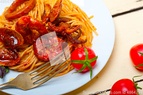 Image of Italian seafood spaghetti pasta on red tomato sauce