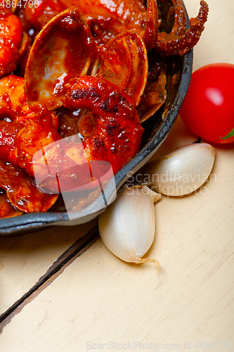 Image of fresh seafoos stew on an iron skillet