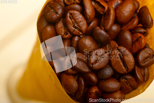 Image of espresso coffee beans on a paper cone