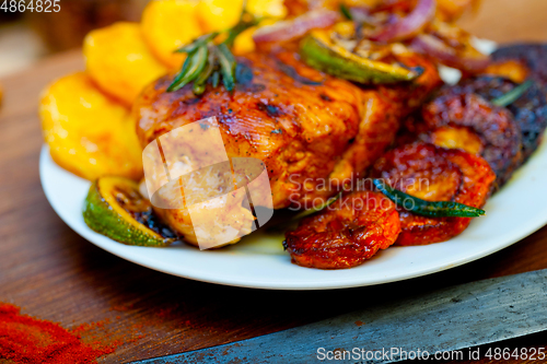 Image of roasted grilled BBQ chicken breast with herbs and spices