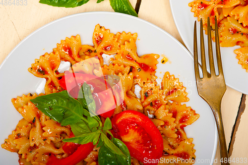 Image of Italian pasta farfalle butterfly bow-tie and tomato sauce