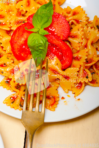 Image of Italian pasta farfalle butterfly bow-tie and tomato sauce