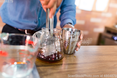 Image of Barista making a drip coffee in cafe