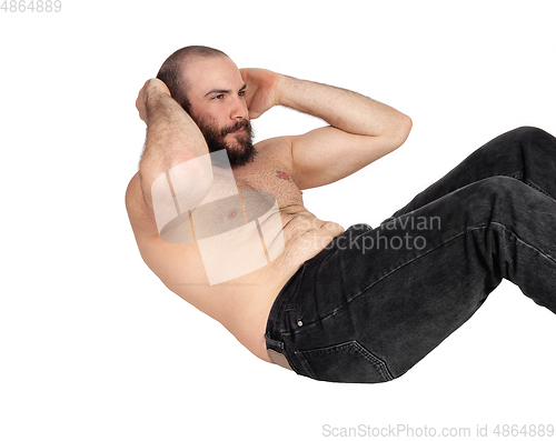 Image of Man doing stomach crunches in the studio