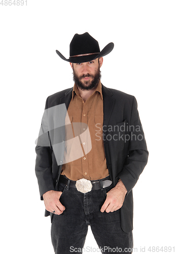 Image of Man in gray jacket and cowboy hat, hand in pocket