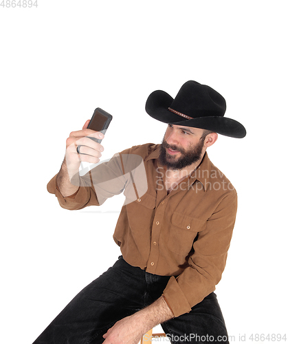 Image of Man with cowboy hat talking a selfie