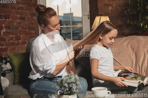 Image of Mother and daughter during self-insulation at home while quarantined, family time cozy and comfort