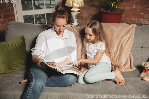 Image of Mother and daughter during self-insulation at home while quarantined, family time cozy and comfort