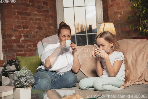 Image of Mother and daughter during self-insulation at home while quarantined, family time cozy and comfort
