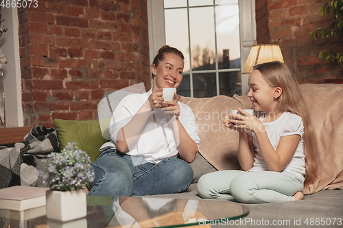 Image of Mother and daughter during self-insulation at home while quarantined, family time cozy and comfort