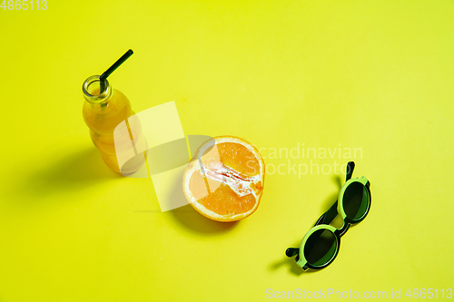 Image of Monochrome stylish composition in yellow color. Top view, flat lay.