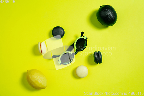 Image of Monochrome stylish composition in yellow color. Top view, flat lay.