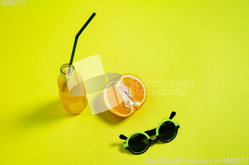 Image of Monochrome stylish composition in yellow color. Top view, flat lay.