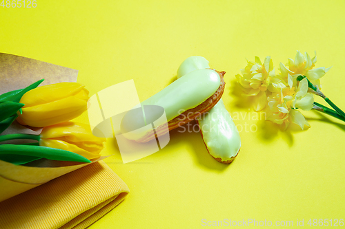 Image of Monochrome stylish composition in yellow color. Top view, flat lay.