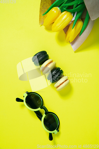 Image of Monochrome stylish composition in yellow color. Top view, flat lay.