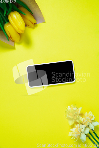 Image of Monochrome stylish composition in yellow color. Top view, flat lay.