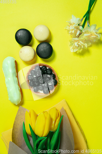 Image of Monochrome stylish composition in yellow color. Top view, flat lay.