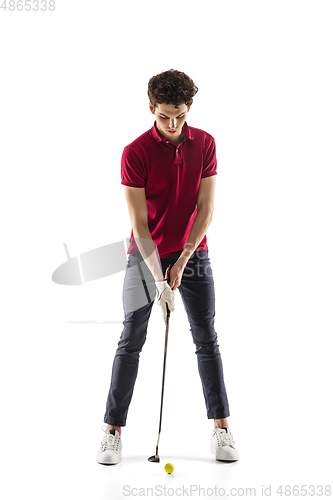 Image of Golf player in a red shirt training, practicing isolated on white studio background