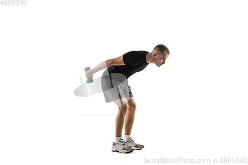 Image of Young caucasian male model in action, motion isolated on white background. Concept of sport, movement, energy and dynamic, healthy lifestyle. Training, practicing.