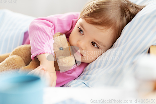 Image of little girl lying in bed at home