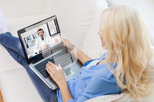 Image of woman having video call with male doctor on laptop