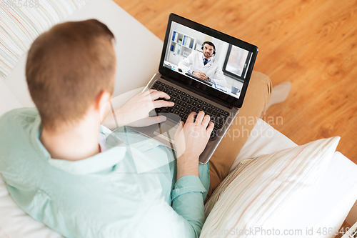 Image of man having video call with male doctor on laptop