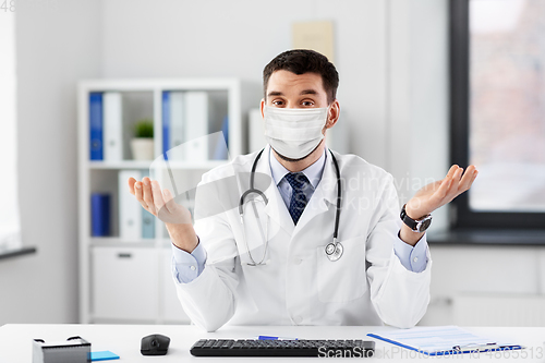Image of male doctor having video conference at hospital