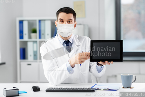 Image of doctor with tablet pc having video call at clinic