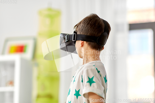 Image of boy in virtual reality headset or 3d glasses