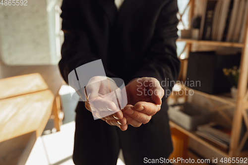 Image of Close up of caucasian male hands, working in office, business, people
